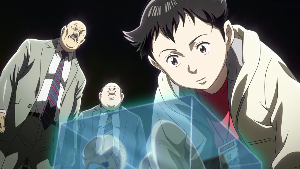Atom and 2 other men looking in a clear box.